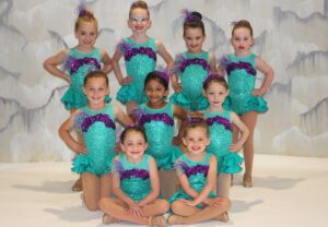 Tap Class Students in purple and turquoise dance costume.