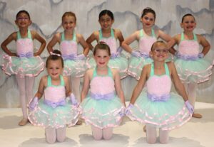 Mid American Studio Ballet Class Students posing for picture day in pink, green, and purple dance costume.